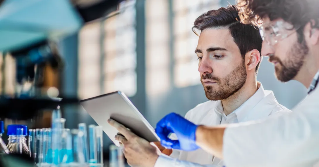 Two scientists standing in a laboratory Two scientists standing in a laboratory