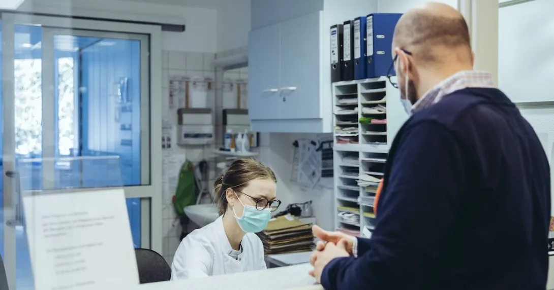 Healthcare professional interacting with patient Healthcare professional interacting with patient
