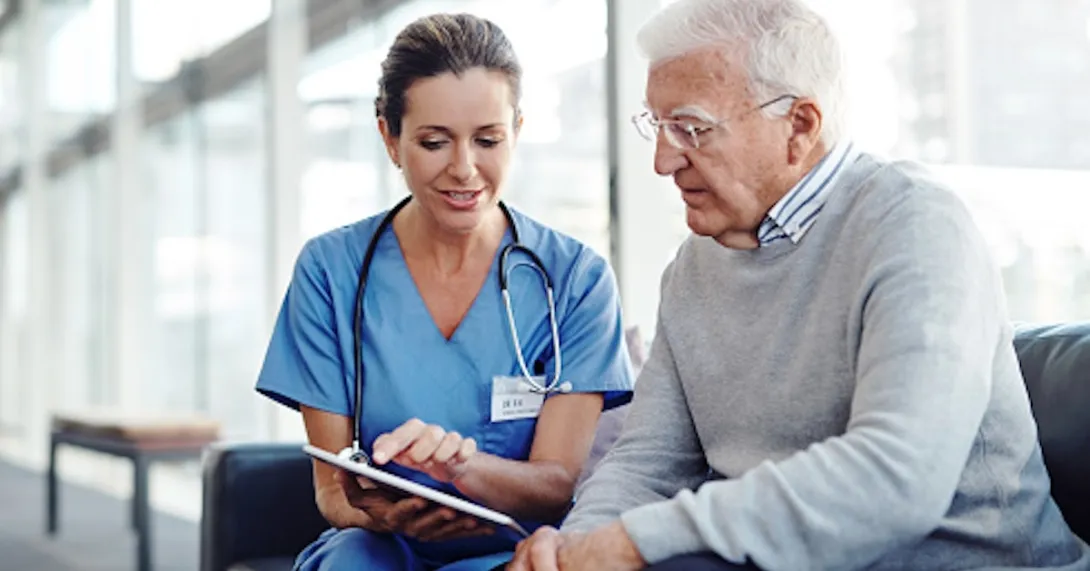 Older patient speaking with healthcare professional Older patient speaking with healthcare professional