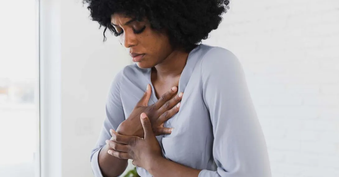 
  Person holding their chest
