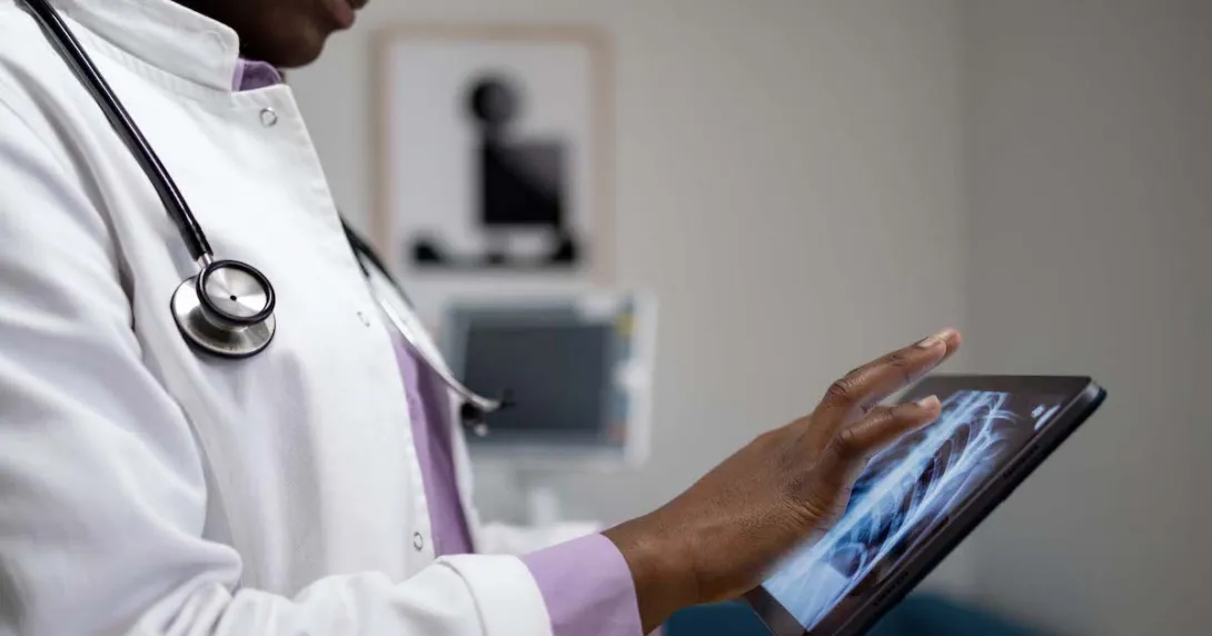 Healthcare provider looking at x-ray images on a tablet
Healthcare provider looking at x-ray images on a tablet