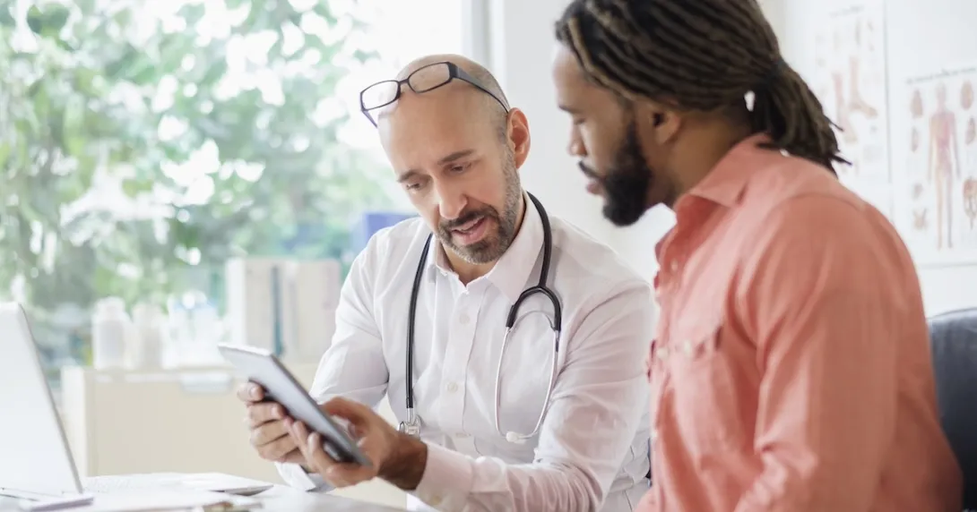 Health care professional consulting with patient Health care professional consulting with patient