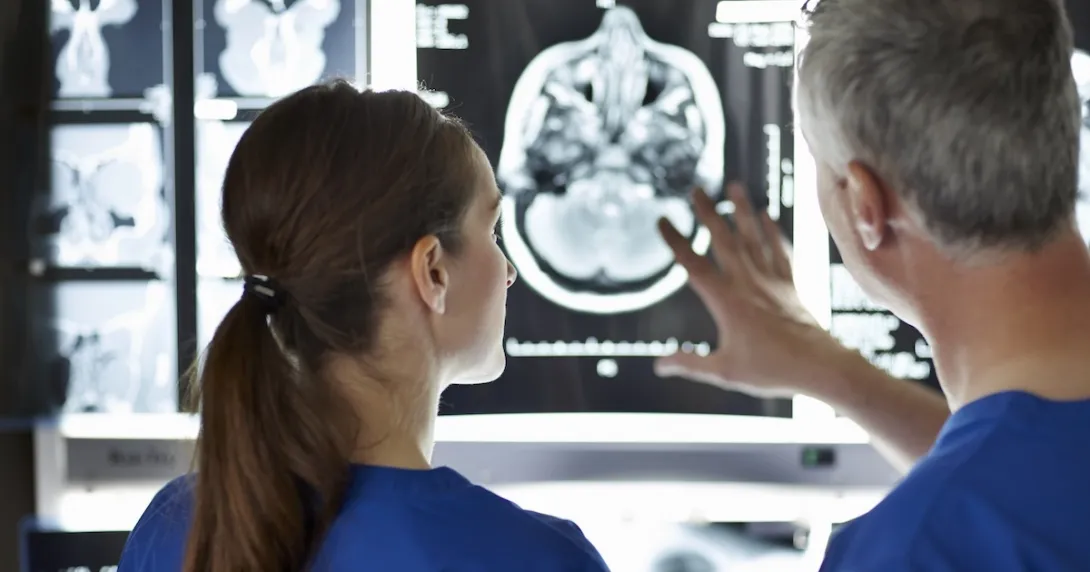 Healthcare professionals looking at MRI of the brain Healthcare professionals looking at MRI of the brain