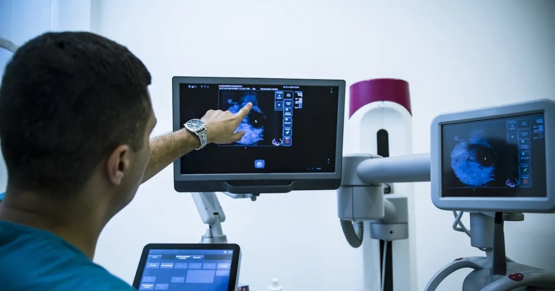Radiologist reviewing mammogram results Radiologist reviewing mammogram results