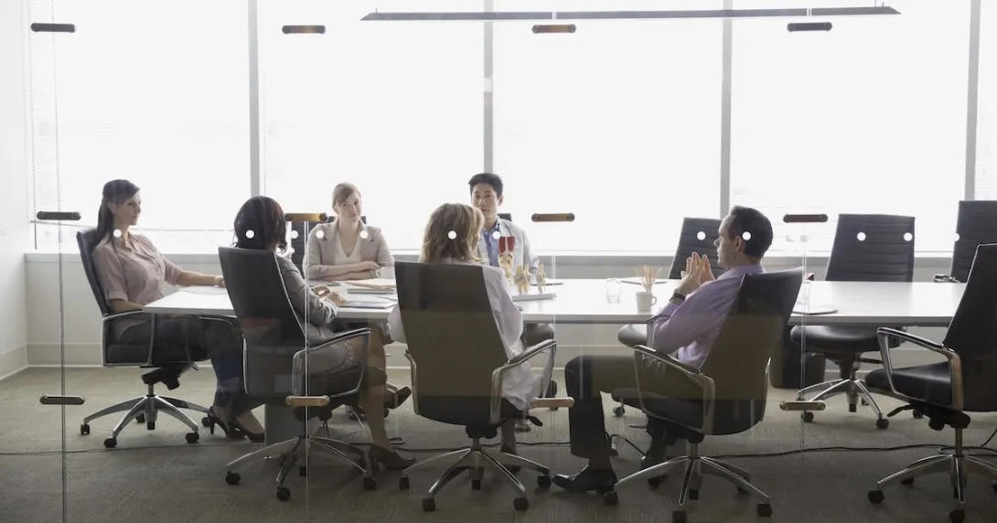 Executives meeting in a conference room Executives meeting in a conference room