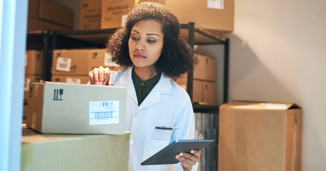 Pharmacist preparing to ship product Pharmacist preparing to ship product