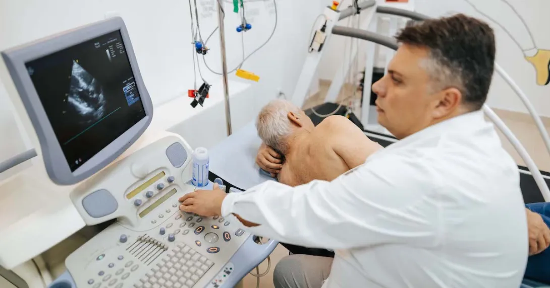 A doctor conducting a cardiac ultrasound.
A doctor conducting a cardiac ultrasound.