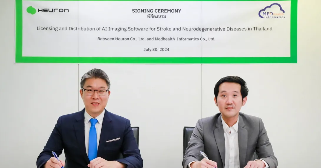 Heuron and Medhealth Informatics representatives during a distribution deal signing Heuron and Medhealth Informatics representatives during a distribution deal signing