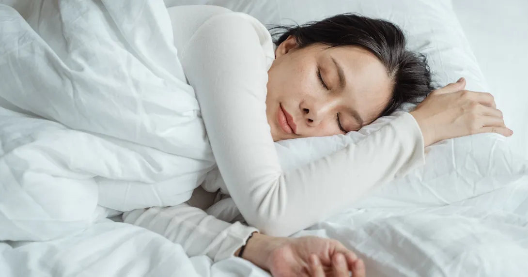 A person sleeping in bed A person sleeping in bed