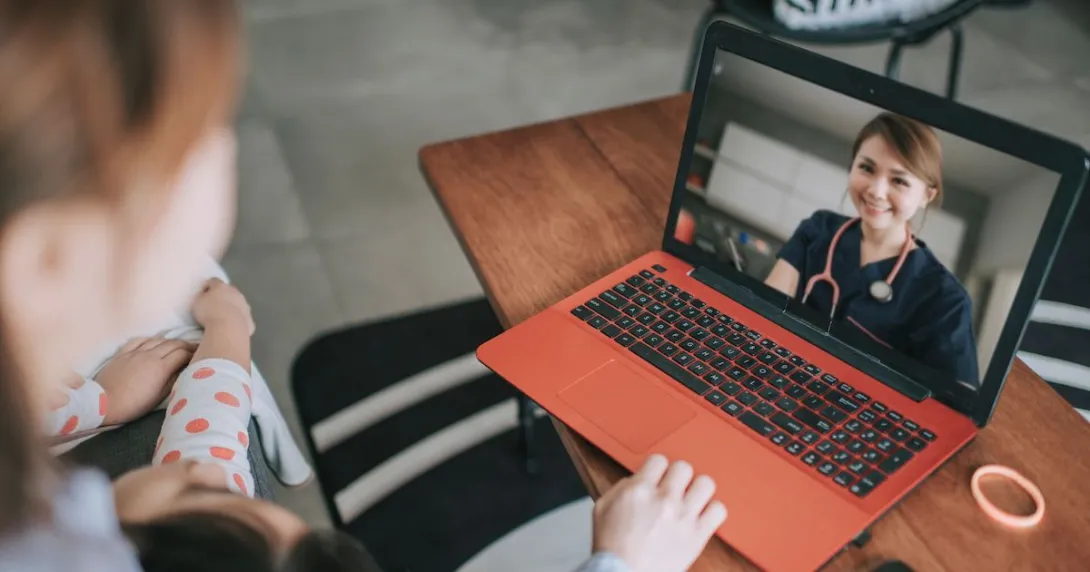 A person talking to a provider on a video chat.
A person talking to a provider on a video chat.