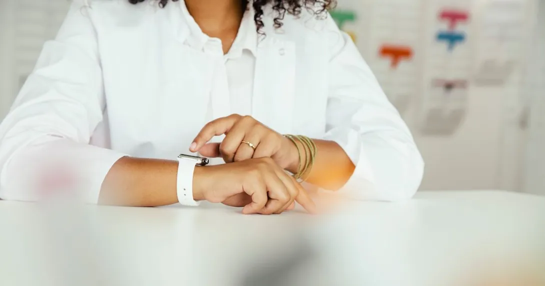 A close-up of a person sitting while wearing a smartwatch
A close-up of a person sitting while wearing a smartwatch