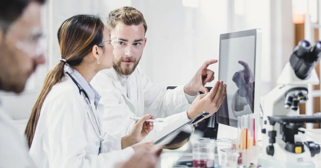 Healthcare providers in a laboratory looking at a computer
Healthcare providers in a laboratory looking at a computer