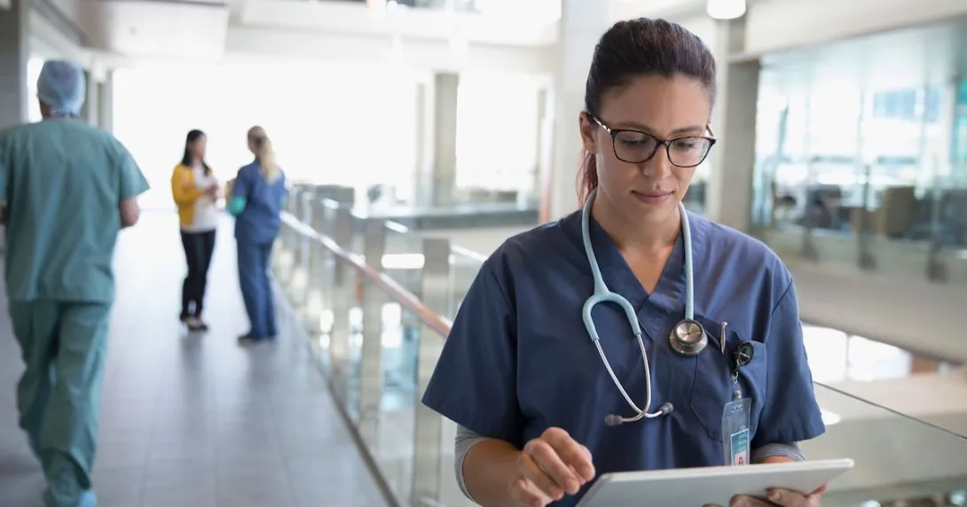 Healthcare provider looking at a tablet
Healthcare provider looking at a tablet