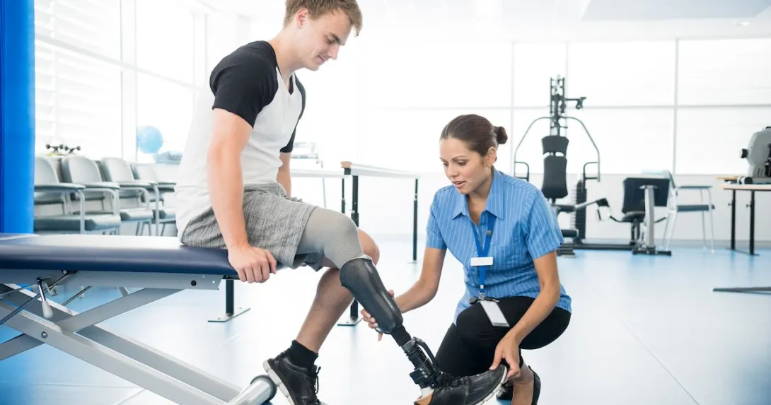 Amputee with a physical therapist Amputee with a physical therapist