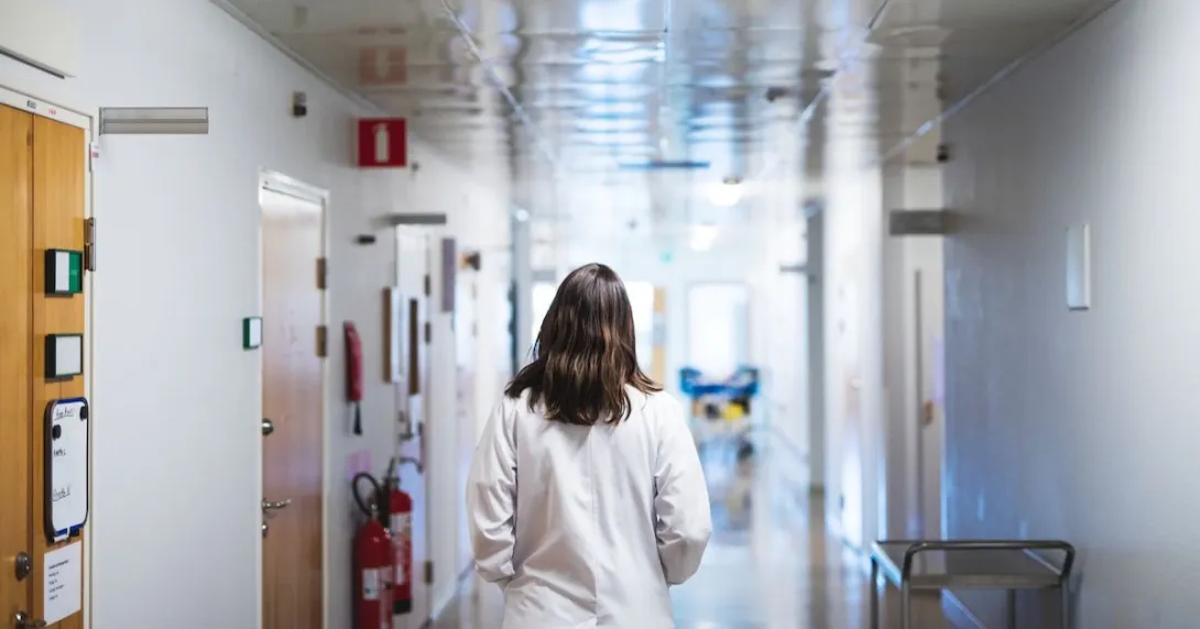 Healthcare worker walking down the hallway in a hospital
Healthcare worker walking down the hallway in a hospital