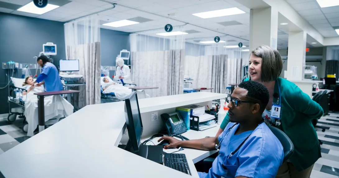 Healthcare providers sitting in a hospital setting