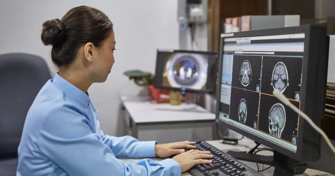 A radiologist examining an X-ray report A radiologist examining an X-ray report