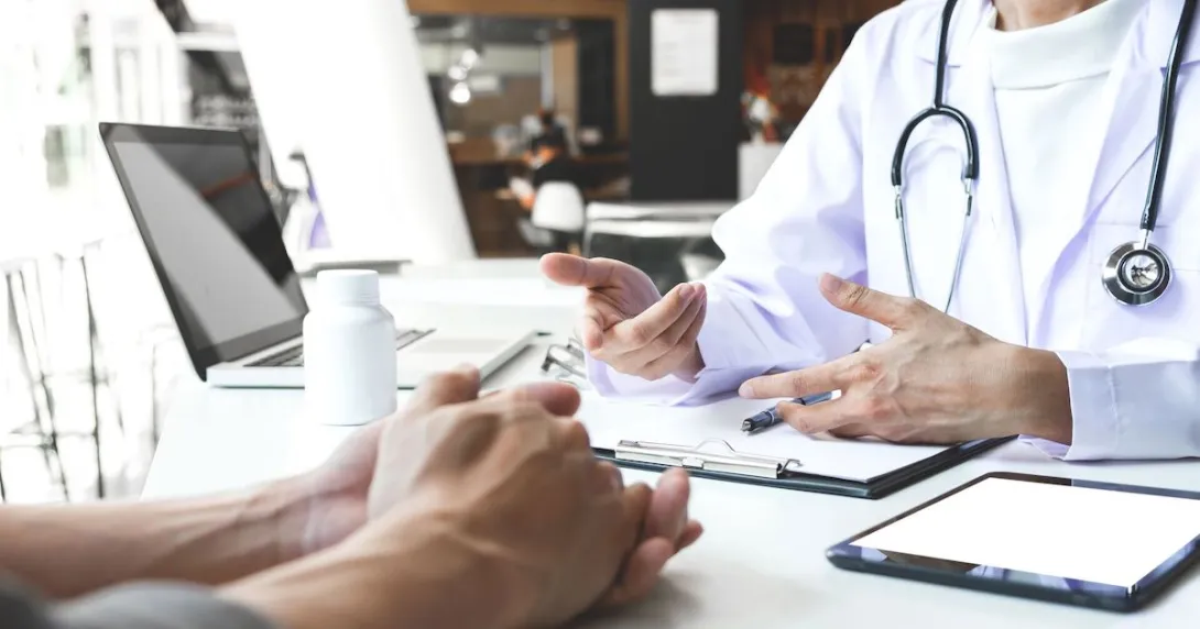 
  A doctor and patient in a face-to-face consultation
