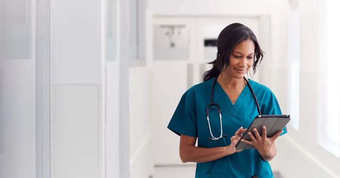 A doctor checking a patient's record on a digital tablet
A doctor checking a patient's record on a digital tablet