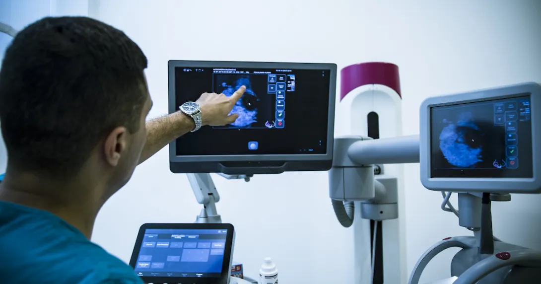 Imaging specialist reviewing a scan Imaging specialist reviewing a scan