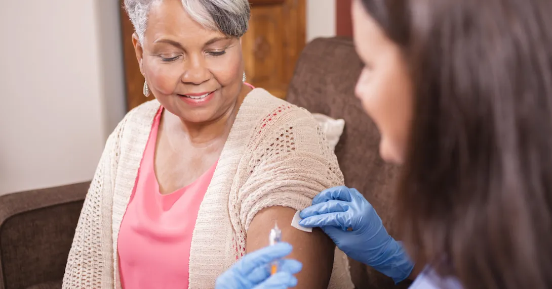 Nurse with a syringe and a patient Nurse with a syringe and a patient