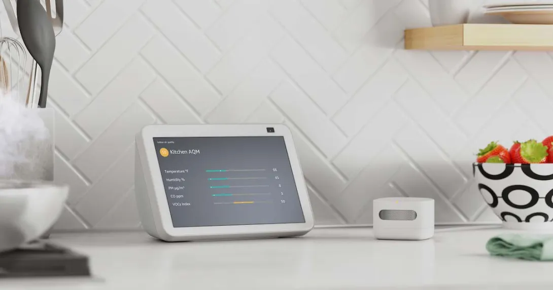 Amazon's air quality monitor next to an Alexa device displaying quality metrics Amazon's air quality monitor next to an Alexa device displaying quality metrics