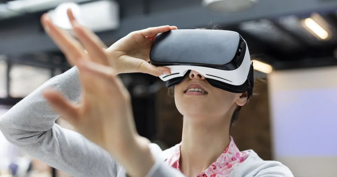 Person wearing a virtual reality headset Person wearing a virtual reality headset
