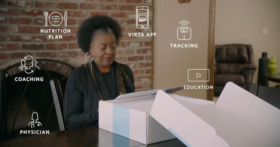 Woman unboxing Virta Health kit