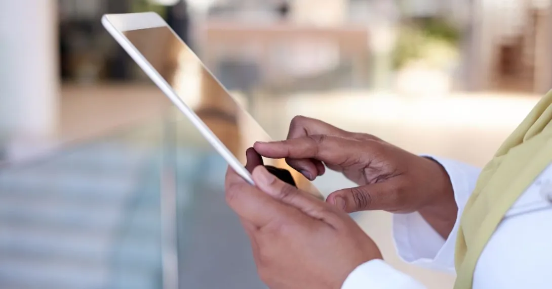 A close-up of a person holding a tablet A close-up of a person holding a tablet