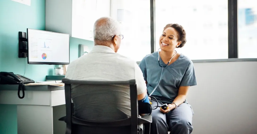 A doctor talking with a patient. A doctor talking with a patient.