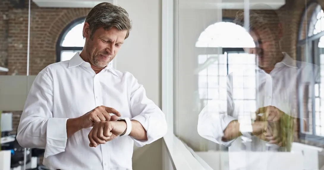 A man wearing a smartwatch A man wearing a smartwatch