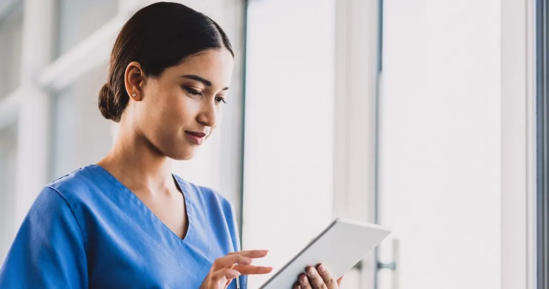 A nurse using a tablet A nurse using a tablet
