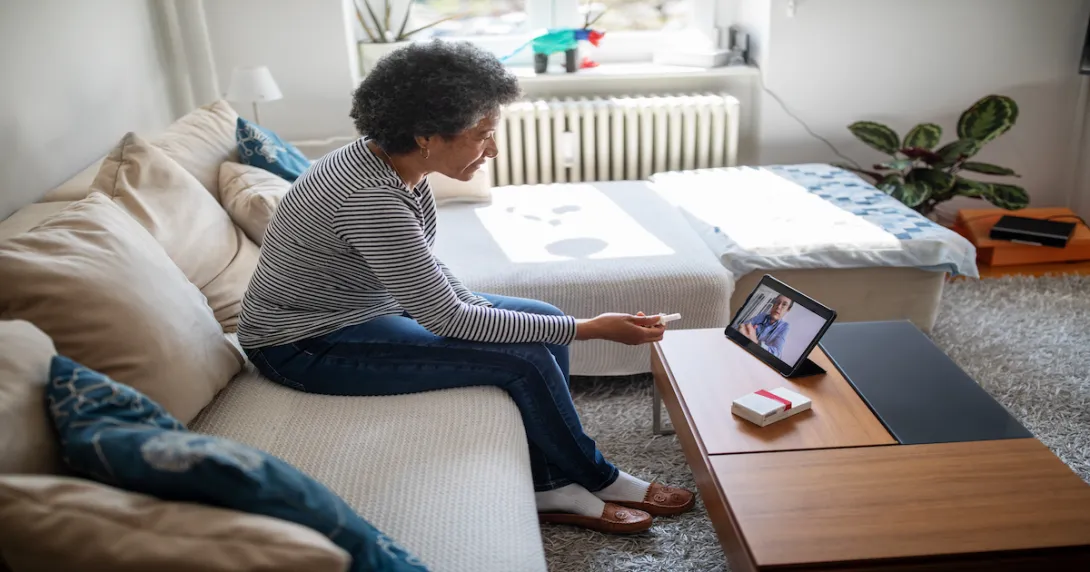 Senior woman on a video telemedicine call with a doctor at home Senior woman on a video telemedicine call with a doctor at home