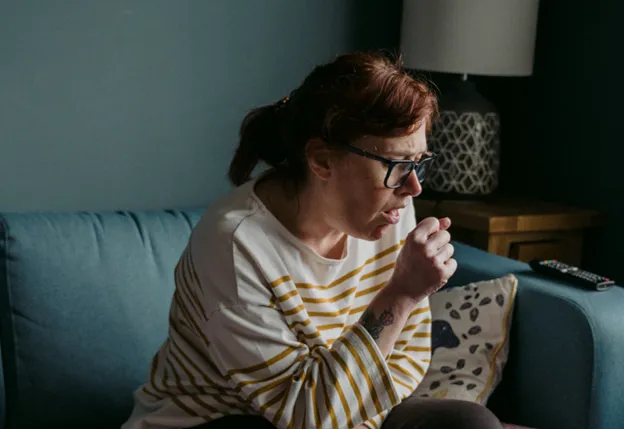 A person coughing.