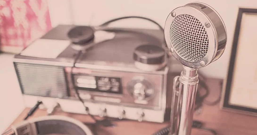 An old-timey microphone and radio setup represent our weekly digital health podcast