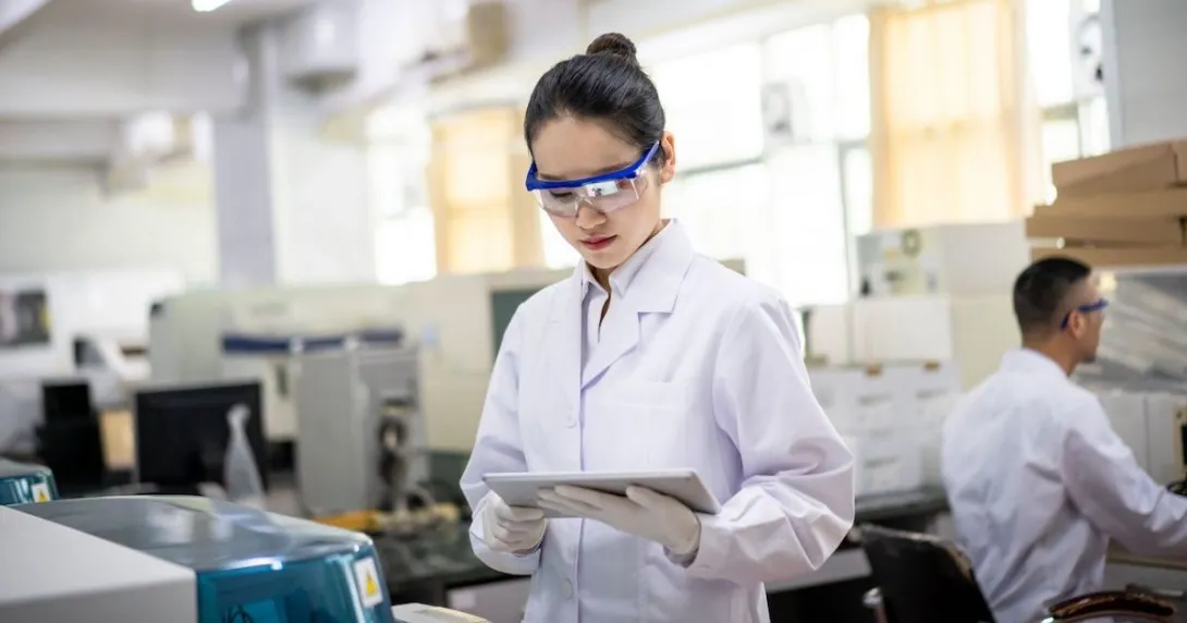 Researcher looking at a tablet Researcher looking at a tablet