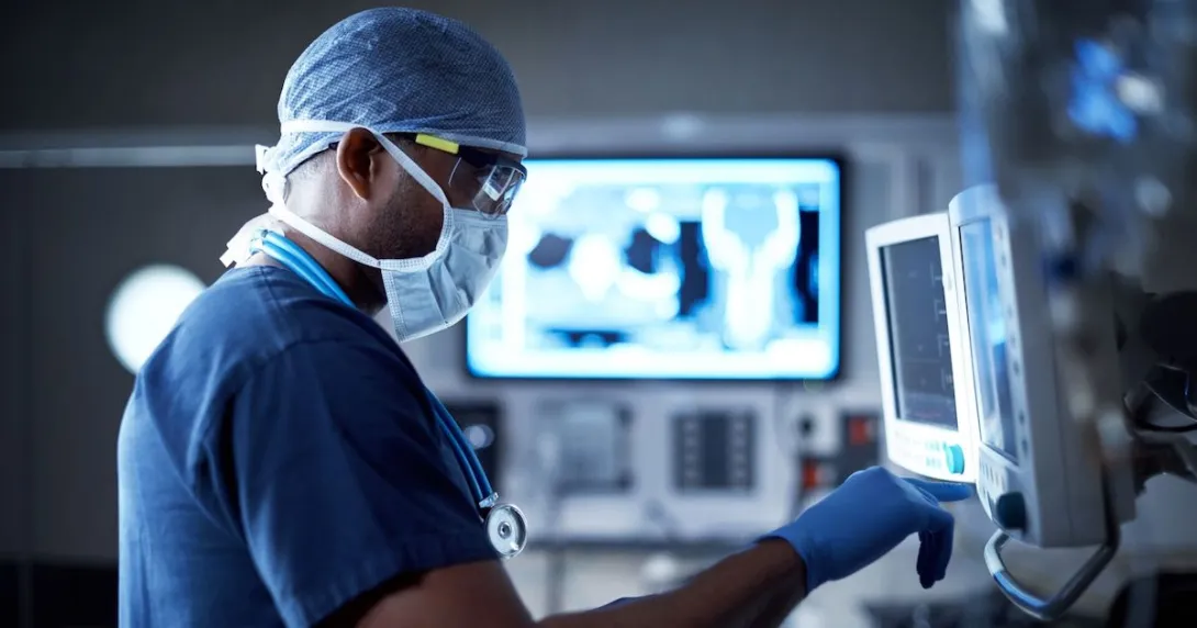 A surgeon looking at a monitor. A surgeon looking at a monitor.