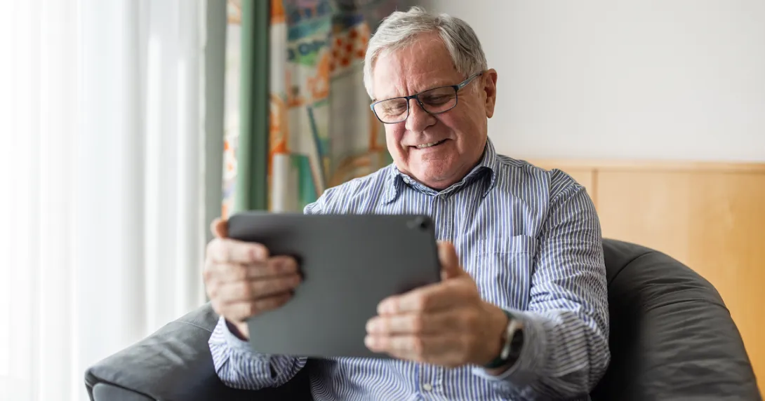 Person talking to a provider via tablet Person talking to a provider via tablet