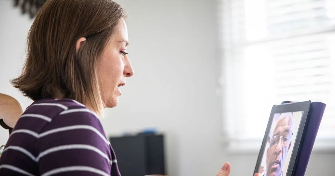 A woman talking to a provider on her tablet A woman talking to a provider on her tablet