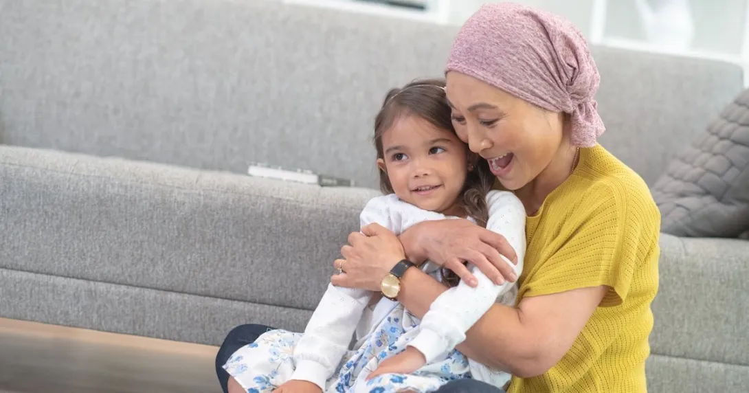 A woman holding a child while playing A woman holding a child while playing