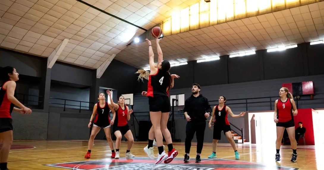 Women playing basketball