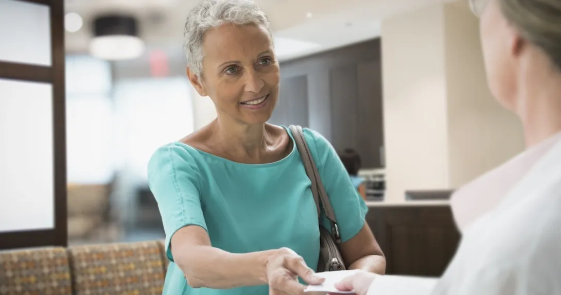 Patient discussing prescription with healthcare professional