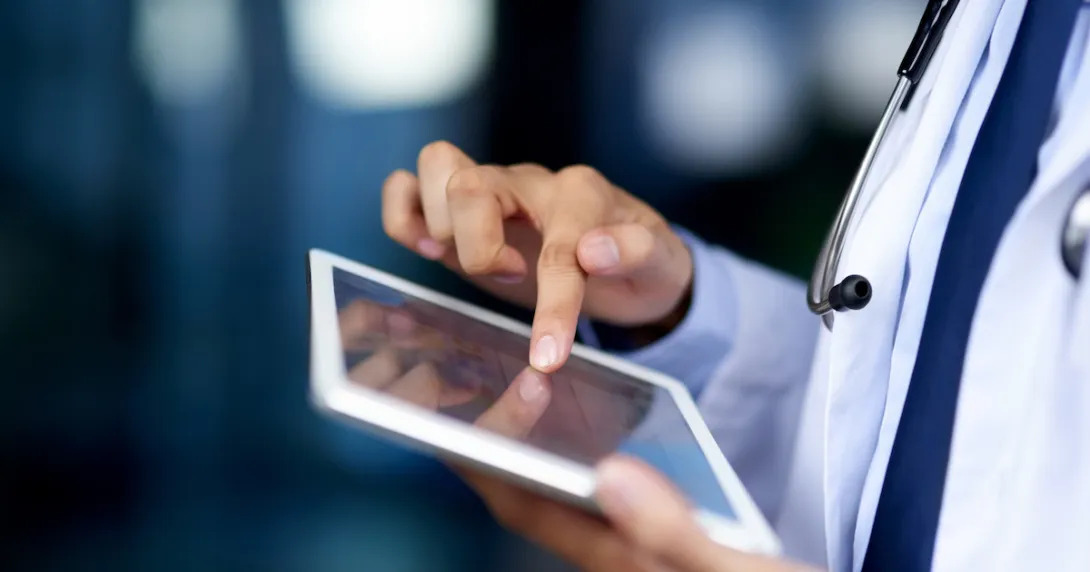 Healthcare provider holding a tablet