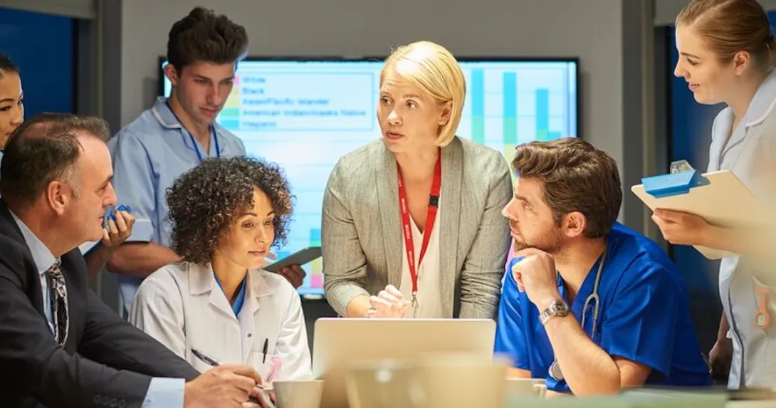 Medical personnel and executives in a conference