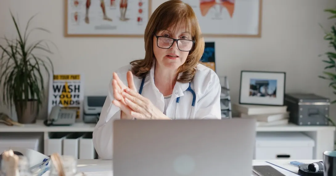 Healthcare professional interacting via laptop computer