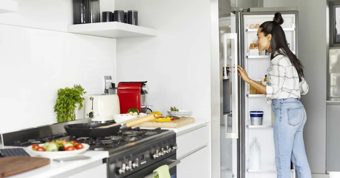Person looking in a refrigerator