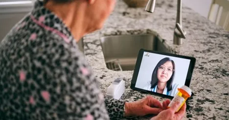 person looking at tablet screen