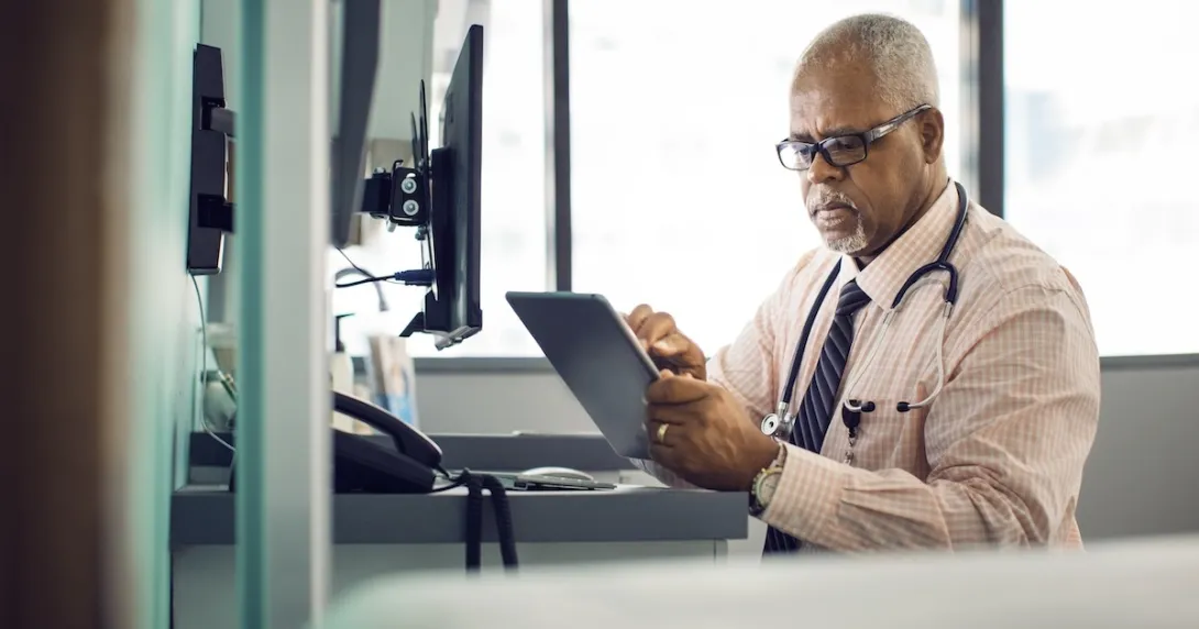 Healthcare professional with a tablet