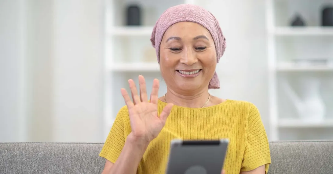 Person waving at tablet