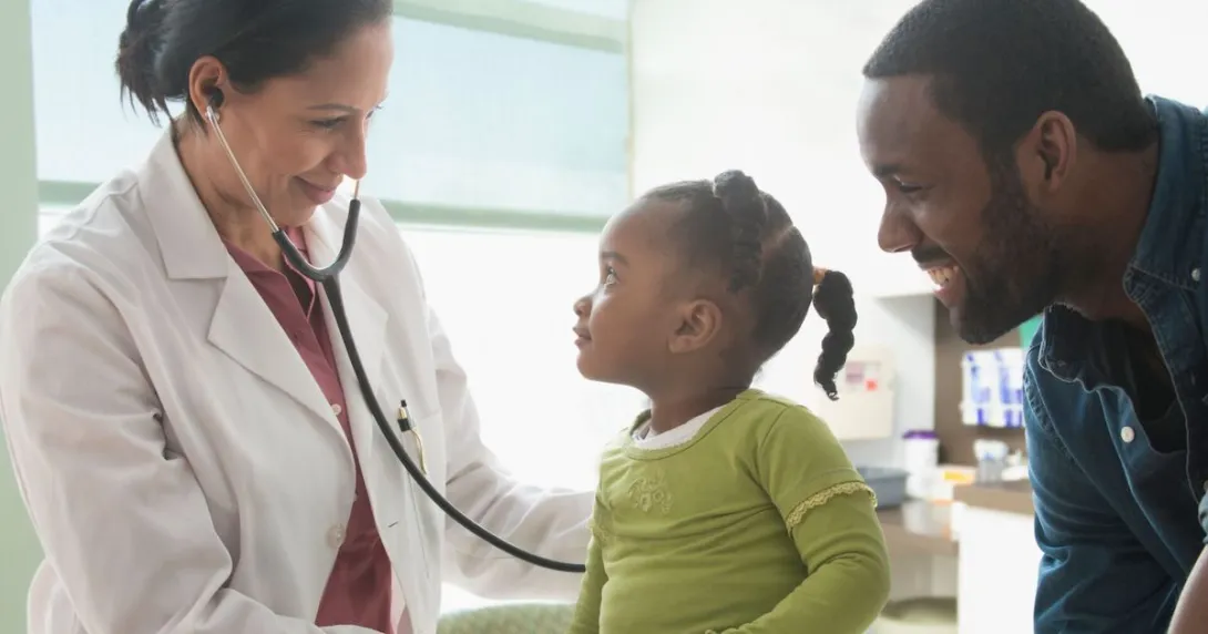 A parent with a toddler at a doctor's appointment